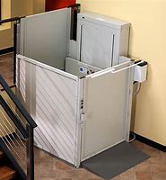 Vertical platform lift with safety gate